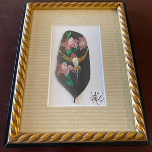 Painted feather in frame